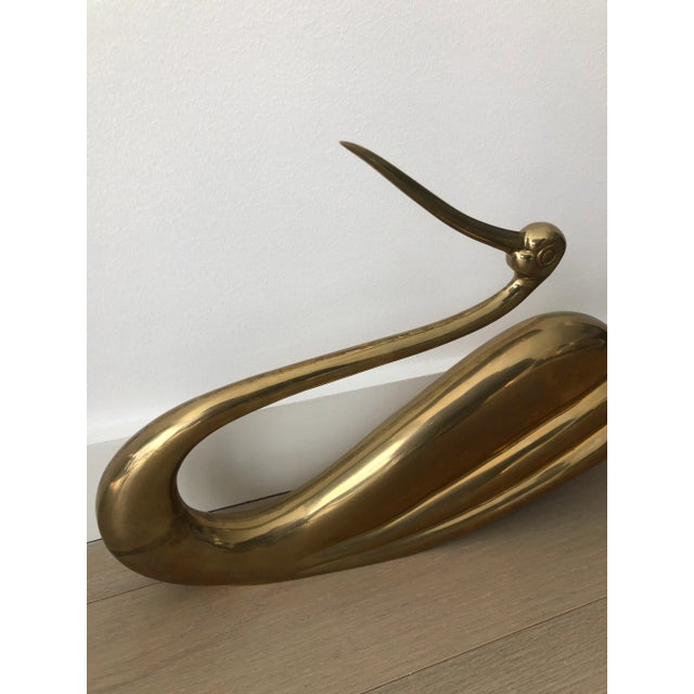 Monumental 1980s brass sculpture in the rare form of a swan or crane. The brass is wonderfully patinated and in excellent...