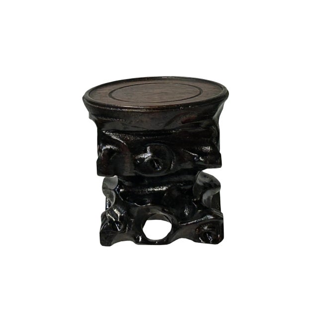 This is a handmade Chinese accent decorative display stand made of dark brown stained wood with irregular stem-like...