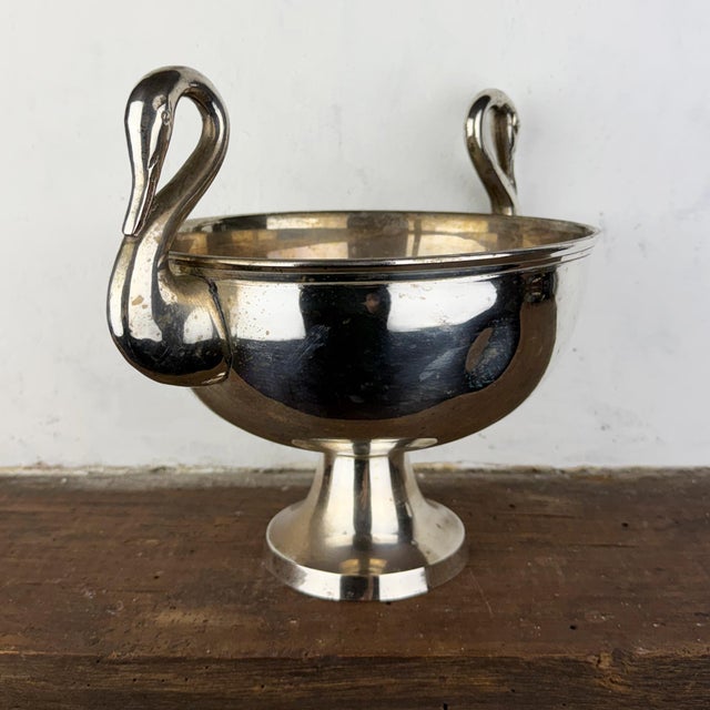 Antique art deco silverplate centerpiece pedestal bowl featuring swan-shaped handles on either side Dimensions: Diameter:...