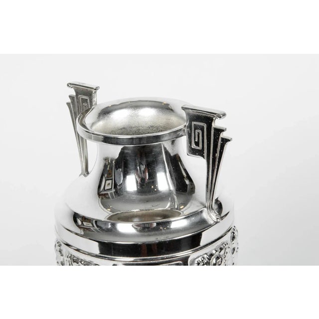 Vintage silver plate Art Deco Greek Revival urn / decorative vase. The piece is in excellent condition. The vase / urn...