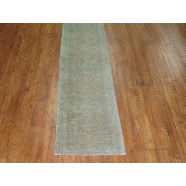 one of a kind hand-made wool mid 20th century neutral turkish runner in gray, brown and light blue tones. some minor age...