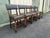 A set of five dark oak barley twist dining chairs from the early 20th century. Each features the classic twisted design on...