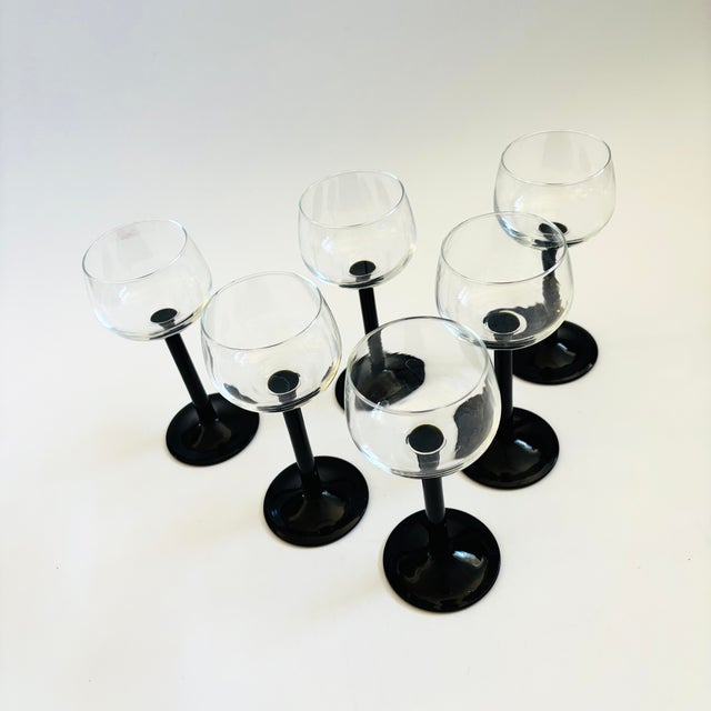 An elegant of set of 6 vintage coupe glasses with black stems. Perfect for champagne. Made in France by Luminarc. Marked...