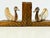 An unique pair of vintage bird bookends combining richly grained carved wooden heads with gracefully curved bodies in a...