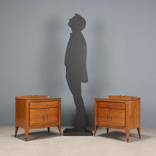 Pair of bedside tables with hinged doors and drawer under the top, in walnut veneer, brass handles and top with...
