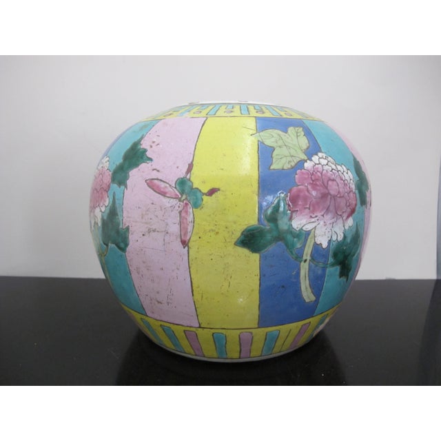 Vibrant Chinese porcelain Famille Rose ginger jar or vase. Colorful enamel painted stripes with butterflies and flowers....