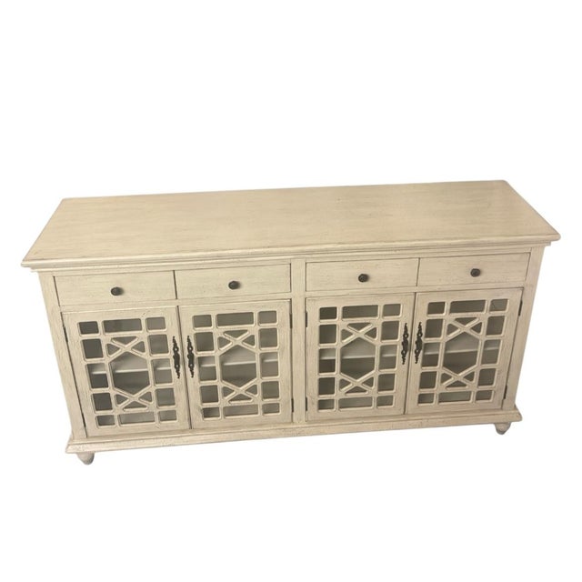 This elegant, large-scale sideboard offers a perfect blend of shabby chic charm and transitional functionality. Finished...