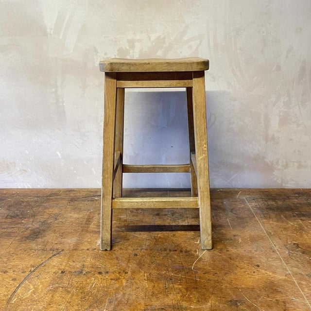 A lovely wooden lab bar stool. Approximate measurements: Height: 56cm Width (at feet): 34cm Depth (at feet): 34cm Seat:...