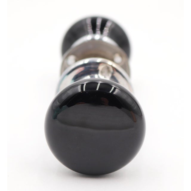 Vintage round shaped black glass door knobs with a nickel plated brass shank and rosettes. Priced as two door knobs, two...