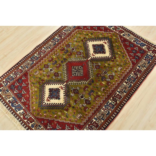 An authentic vintage tribal Yalameh rug hand-knotted with fine wool and natural dyes. This nomadic oriental rug features...