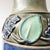 A striking antique stoneware vase from the Royal Doulton Lambeth studio. The design features a tube-lined collar foliage...