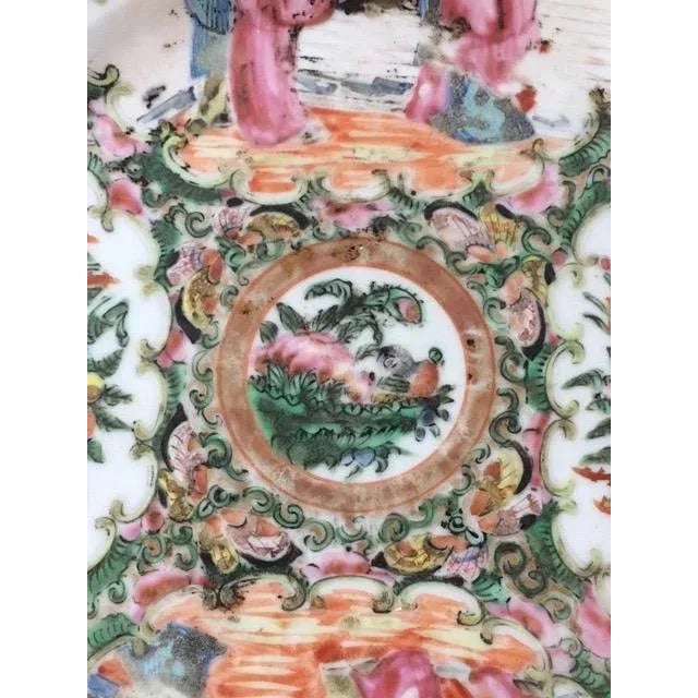 19th century rose medallion plate decorated with four panels.. Two are figural and two have birds and flowers. Condition...