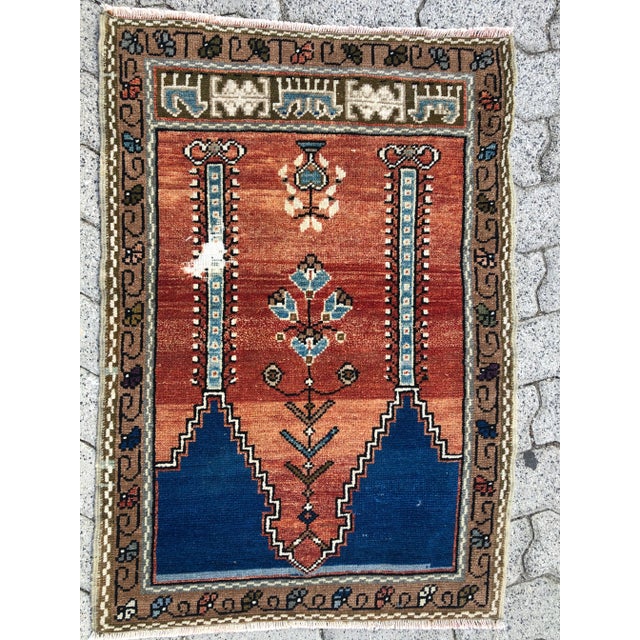 This is a vintage Turkish Oushak rug from the 1960s. The piece was hand-knotted.