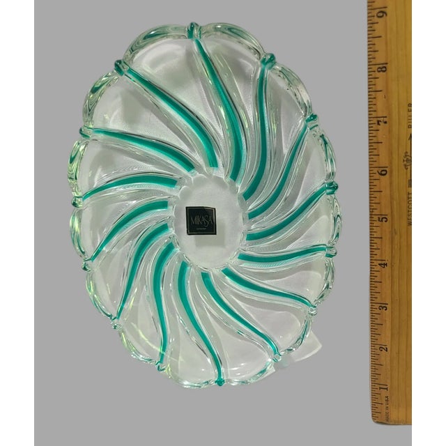 This Mikasa oval tray dish is a beautiful addition to your collection. The green striped pattern adds a touch of elegance...