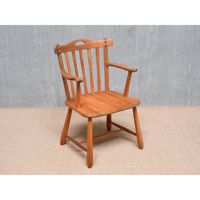 This rare armchair was produced by the Swedish company Nordiska Kompaniet in the early 1940s. It belongs to the 'Hytte'...