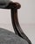 A armchair whose charcoal/black upholstery, dark wood frame gives it real character at first glance. It was made in France...