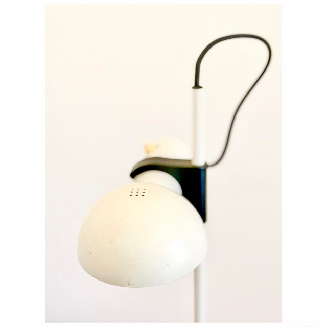 This striking postmodern table lamp was produced during the 1980s. The design combines simple geometric volumes with...