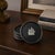 Vintage Swedish Lerstorp coasters crafted from black isolite-style compressed wood fiber with silver-tone sailing ship...