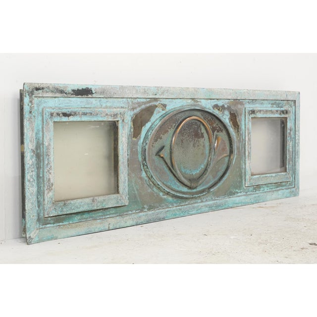 Antique Belgian Post Office window panel made of a bronze frame with a verdigris finish, two clear glass panels, and a...