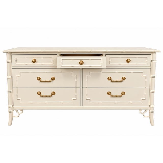 Bring timeless elegance to your home with this beautifully detailed vintage faux bamboo dresser, featuring classic...
