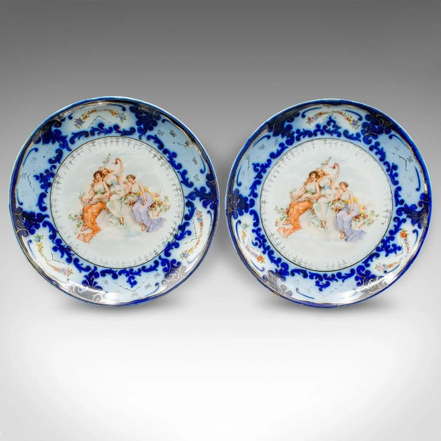This is a pair of antique display plates. An Austrian, ceramic serving charger with classical taste, dating to the late...
