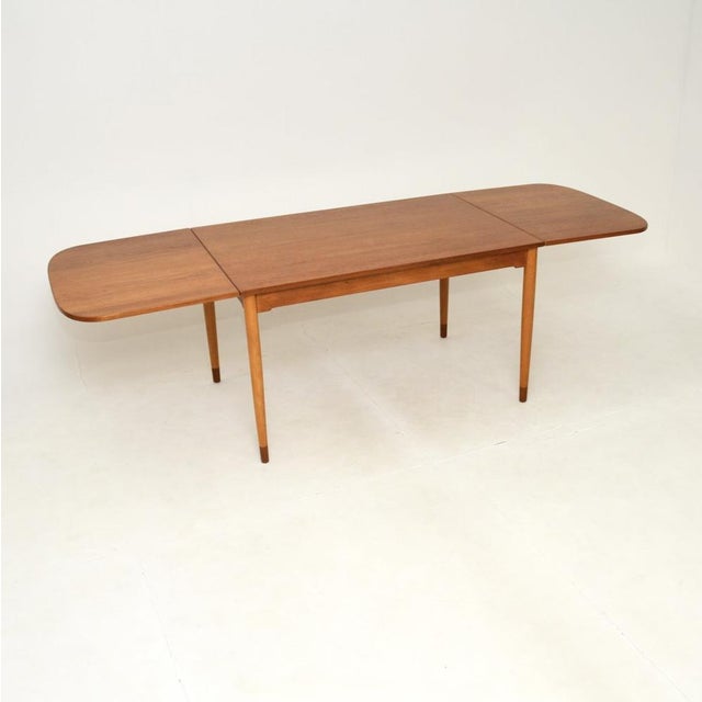 A stunning and rare Danish teak vintage drop leaf dining table by Borge Mogensen. This was made in Denmark by Soborg...