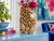 An intricately carved stone vase featuring birds nestled among flowering branches, layered foliage, and sculptural vessel...