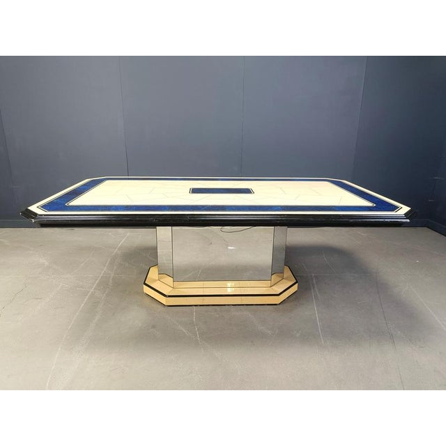 Unique laminated dining table with an ivory coloured table top contrasted with a beautiful blue colour. Mirrored and...