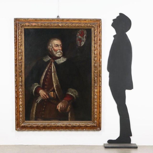 Oil on canvas. Portrait of a nobleman, proud with his hand resting on the hilt of his sword and dressed in a cloak edged...
