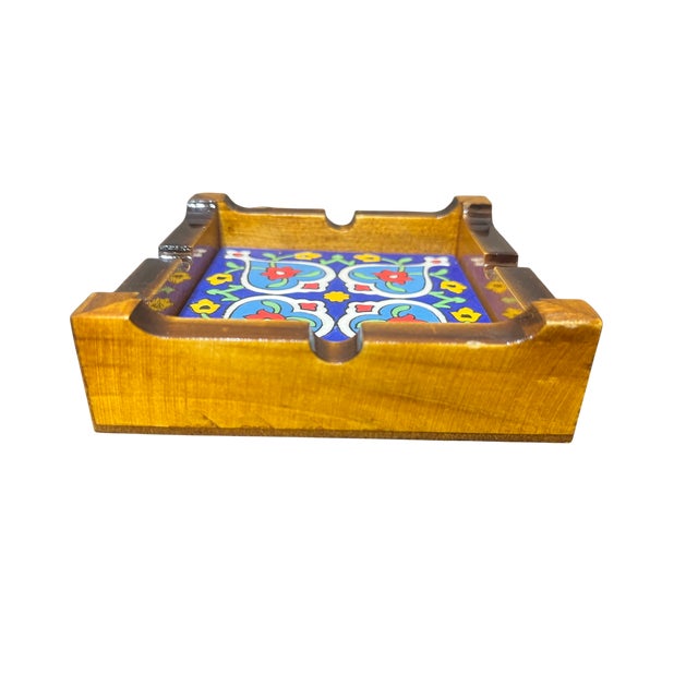 Blossom Relief Ashtray; At the heart of the 10x10 cm frame lies a ceramic tile that demands to be touched. Unlike flat-...