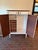 This charming vintage wood armoire combines classic traditional styling with an exceptionally functional fitted interior....
