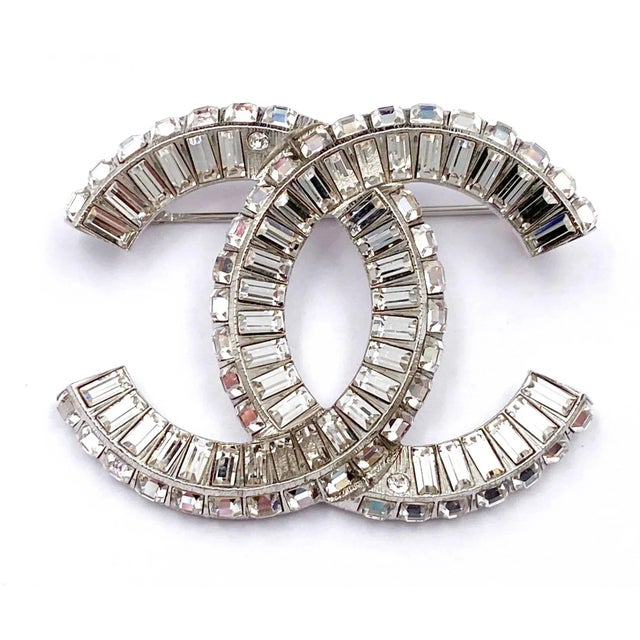 Chanel Classic Silver CC Baguette Crystal Brooch *Marked 18 *Made in France -Approximately 1.5″ x 2″ -Very pretty and...