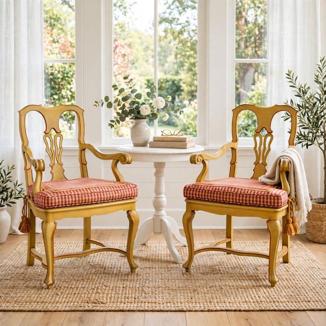 Pair of early 20th century Venetian Rococo side chairs / armchairs in solid wood with a hand-painted Tuscan yellow finish...