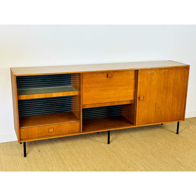 Stunning vintage sideboard with a Scandinavian design from the 1960s, remarkable for its elegance and unique architectural...