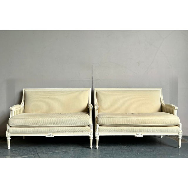 Indulge in timeless elegance with this exquisite pair of vintage Hollywood Regency settees, perfect for adding a touch of...