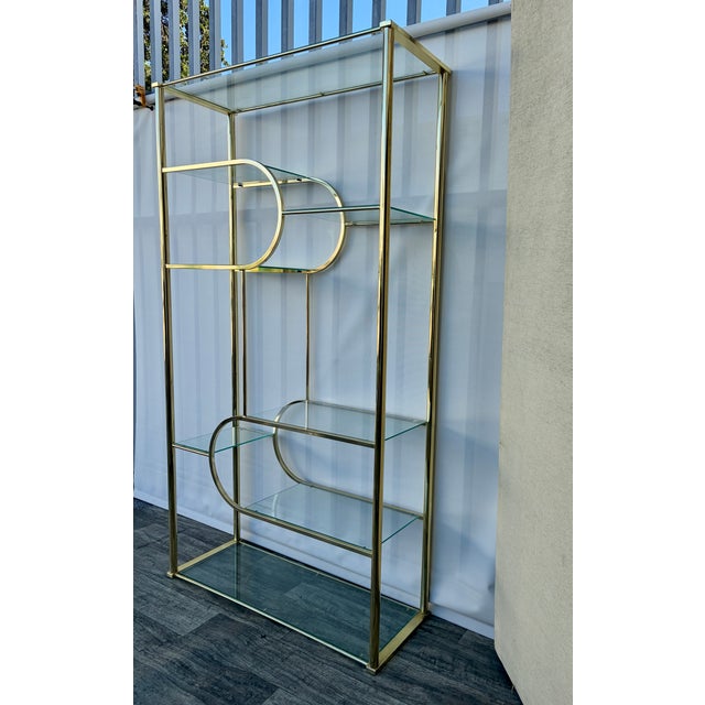 Vintage Mid Century Modern Hollywood Regency Brass Etagere in the Milo Baughman Manner by Design Institute America. Circa...