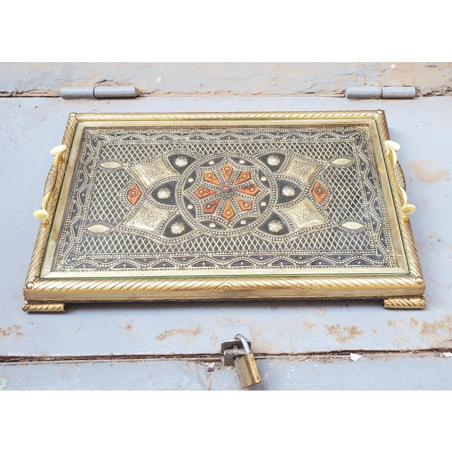 A new arrival. This amazing metal inlaid gold finish Moroccan serving tray measures approximately 18″ in length and 11″ in...