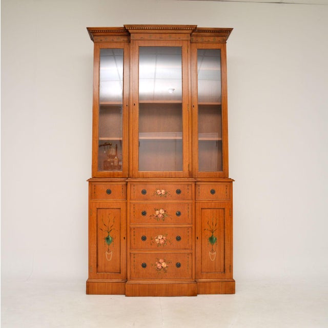 An impressive and very well made antique Georgian style painted satinwood bookcase. This was made in England, it dates...