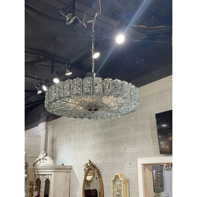 Exquisite modern Murano glass disc shaped chandelier. This piece has beautiful textured glass in a Fontana green color...