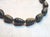 The necklace is 17.5 inches (44.5 cm) long, and the carved beads are approximately 25.5 x 15.5 mm. Each bead is expertly...