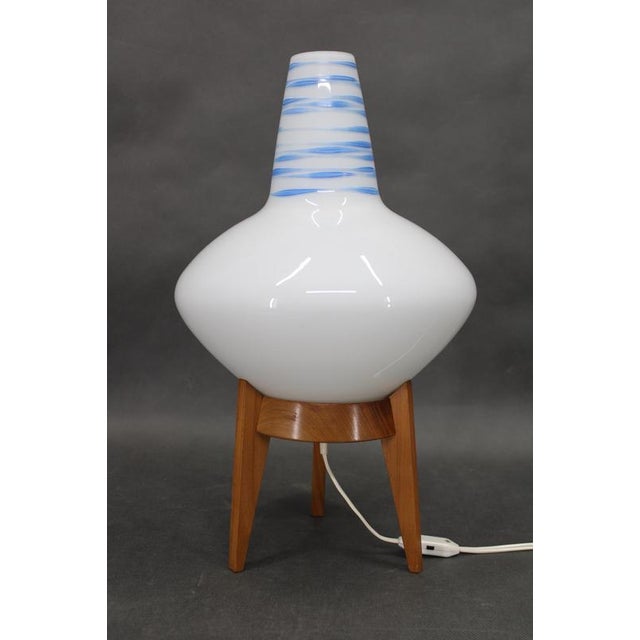 An original mid-century modern table lamp produced by uluv, czechoslovakia, circa 1960s. The lamp features a finely shaped...