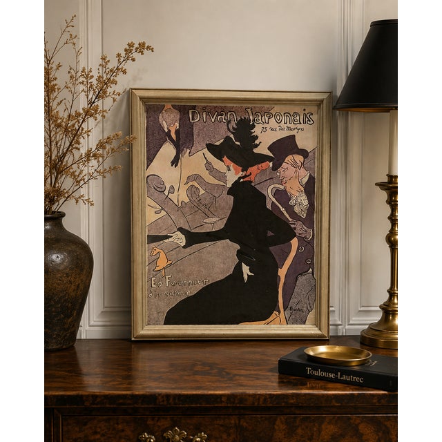 A beautifully framed reproduction of Henri de Toulouse-Lautrec’s iconic “Divan Japonais” poster, one of the defining...
