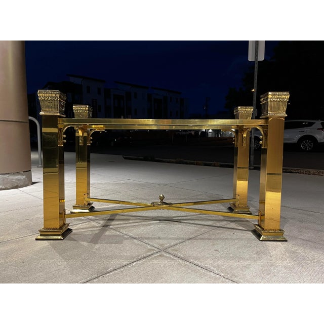 Heavy brass regency console table having pine cone finial center of lower x-stretcher, “base only” not with original glass...