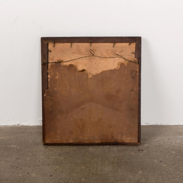 Vintage mirror with a handcrafted frame from around the 1930s.