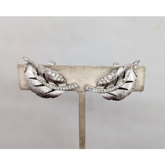 Trifari Vintage 1960 Signed Crown Trifari Rhodium Plated Clear Rhinestone Curled Leaf Clip Earrings-2 Pieces For Sale - Image 4 of 7