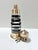 Bring a touch of maritime charm to your bar or library with this striking vintage lighthouse-form cocktail shaker...