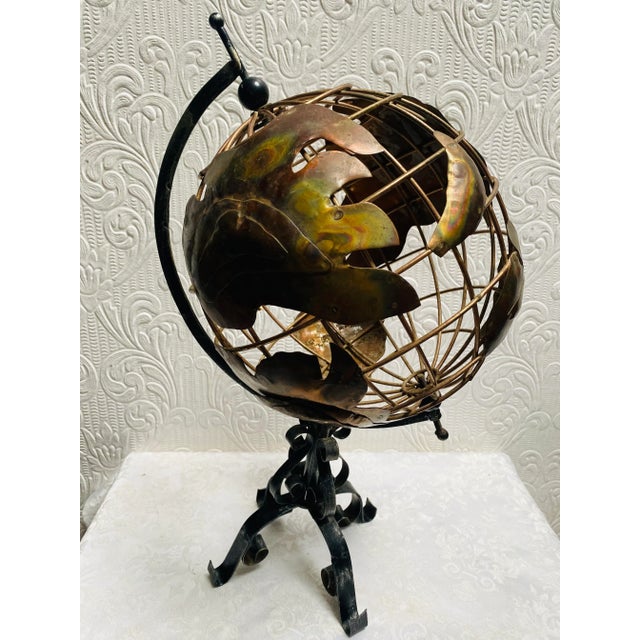 A fabulous, rare vintage 1960’s brass and iron hand made globe that will bring a smile to your face; truly a rare...