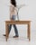 A 19th century French side table crafted in oak and designed in the Louis XVI style, featuring a rectangular top and...