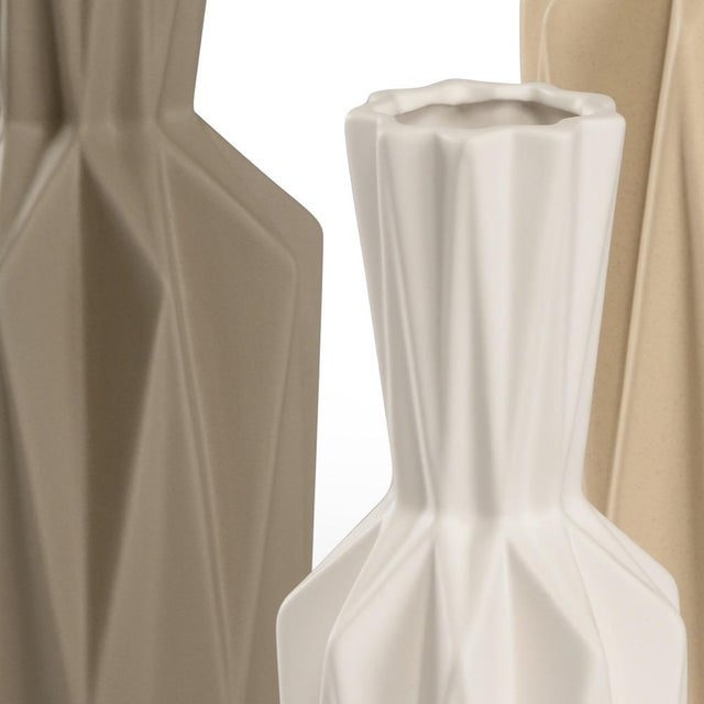 Set of 3 geometric shaped vases with white, charcoal and tan glaze. Small 12"h x 4.5"W x 4.5"D medium 16"h x 6"w x 6"d...