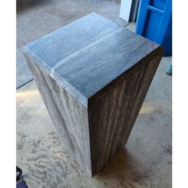 Elevate your space with this stunning, sold-out CB2 Tura Tall Brown Travertine Pedestal Table. Designed by Barcelona-based...
